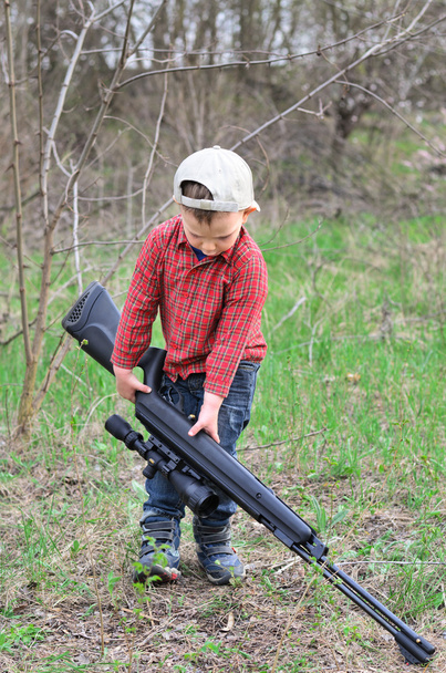 Small boy lugging a sporting rifle - Photo, Image