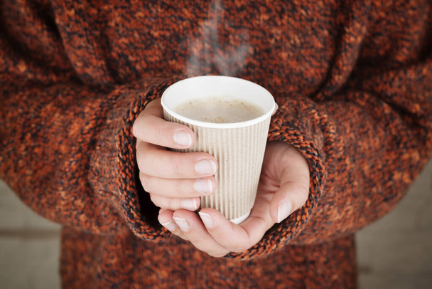 Hot drink in woman hands. - Фото, зображення