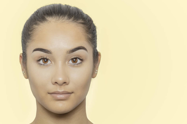 Portrait of  young beautiful mixed race woman face isolated. - Foto, Imagen