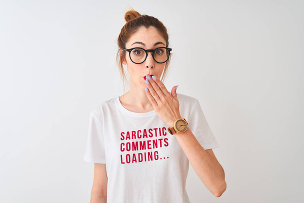 Redhead woman wearing funny t-shirt with irony comments over isolated white background cover mouth with hand shocked with shame for mistake, expression of fear, scared in silence, secret concept - Photo, Image