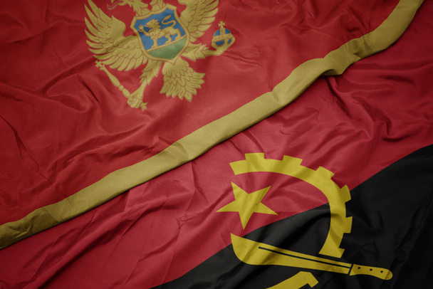 acenando bandeira colorida de angola e bandeira nacional de monten=
. - Foto, Imagem