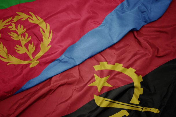 waving colorful flag of angola and national flag of eritrea. - Photo, Image