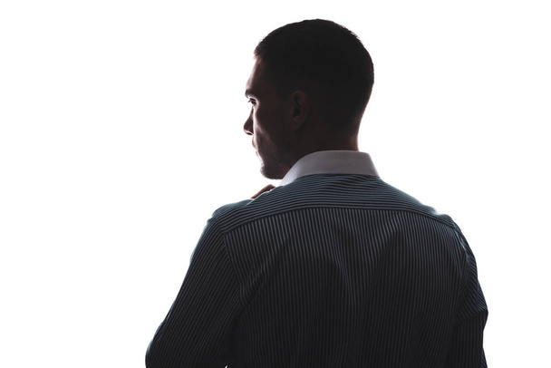 silhouette d'une chemise blanche masculine du dos orientée dans la direction
 - Photo, image