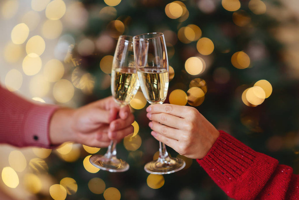 hands with full champagne glasses - 写真・画像