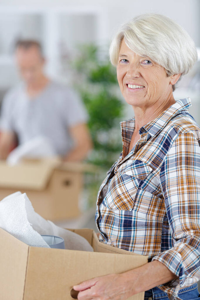 cheerful senior couple moving into new home - Photo, image