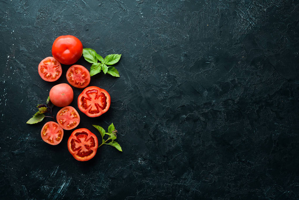 Fresh red tomatoes on white wooden background. Greens. Top view. Free space for your text. - Foto, afbeelding