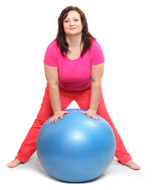 Happy overweight woman with blue ball exercising - Zdjęcie, obraz