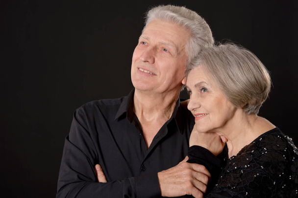 happy Senior couple posing on black background - Photo, Image