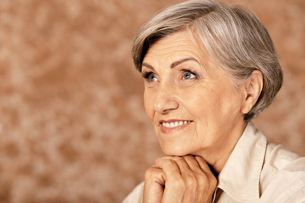 Portrait of happy senior woman at home - Фото, зображення