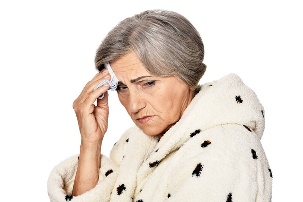  serious senior woman  with headache,  isolated on white - Φωτογραφία, εικόνα