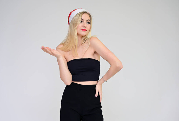 New Year celebration concept with beautiful girl. Portrait of a fashionable beautiful blonde model with long hair, great makeup, on a white background. - Fotoğraf, Görsel
