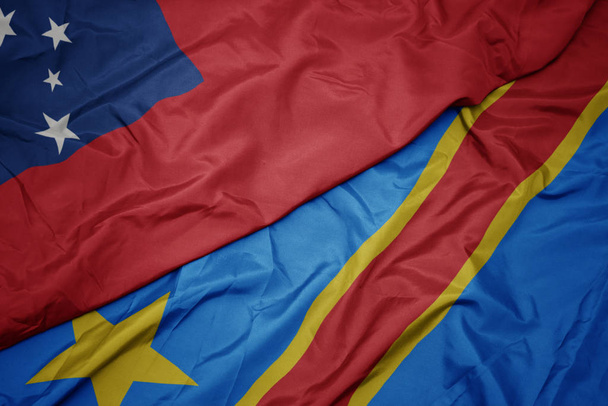 schwenken bunte Flagge der Demokratischen Republik Kongo und Nationalflagge von Samoa . - Foto, Bild