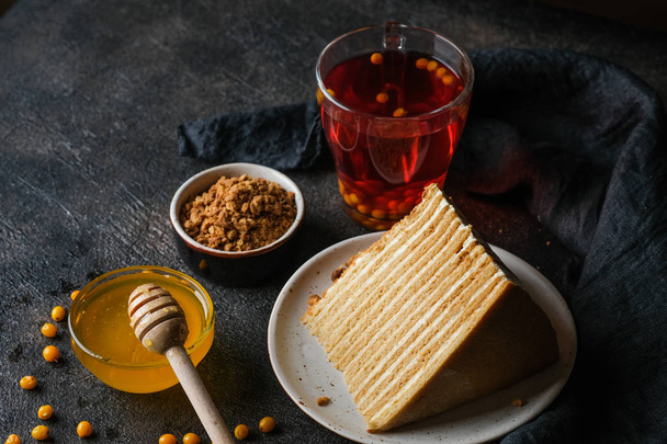 Homemade honey cake on a dark background top view copy space. - Foto, Bild