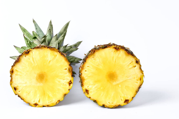 two round halves of pineapple on a white background - Foto, Imagem