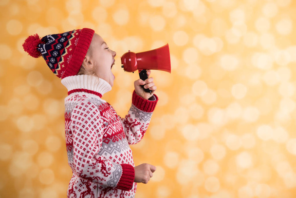 Little girl shouts something into the megaphone - Photo, Image