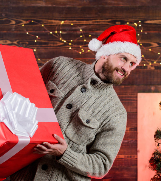 Happy holidays. Santa Claus. Smiling guy with giant gift box. I am here to give present. Delivering happiness to your home. Delivery service. Spread happiness. Giving happiness. Winter happiness - Fotoğraf, Görsel
