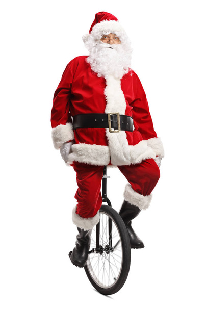Санта Клаус на моноциклі
 - Фото, зображення