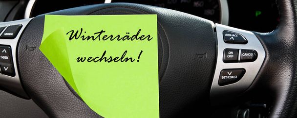 Alemão rodas de inverno mudar carro painel de fundo com etiqueta
 - Foto, Imagem