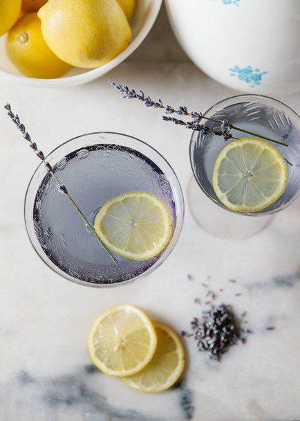 Lavender lemonade cocktails on white marble surface  - Valokuva, kuva