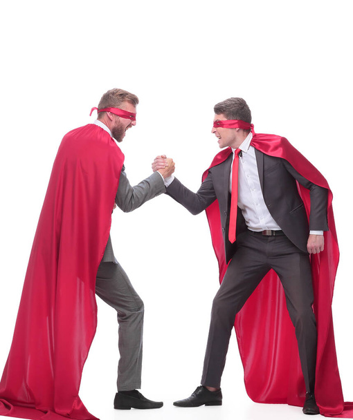 business competitors in Superman capes showing their strength - 写真・画像