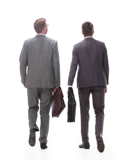 rear view. two business men walking together. - Zdjęcie, obraz