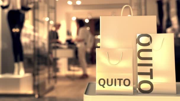 Papieren zakken met Quito tekst. Winkelen in Ecuador gerelateerde 3d animatie - Video