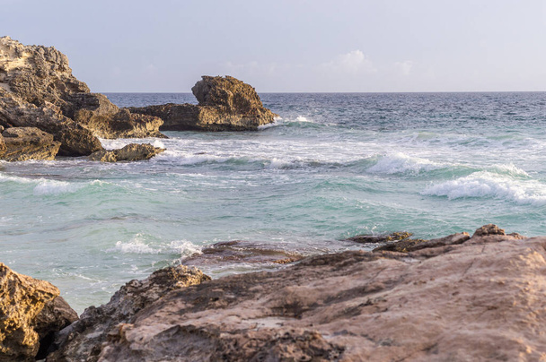Caribbean sea coast with rocks and hello breaking - Photo, Image