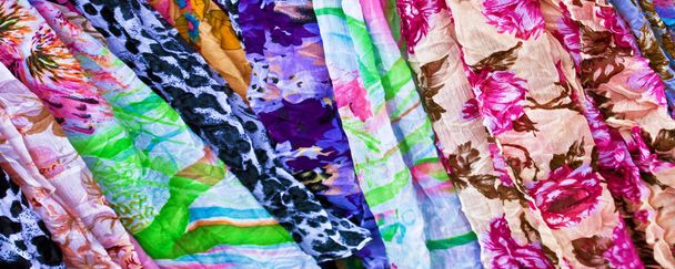 Colourful textiles as background banner - 写真・画像