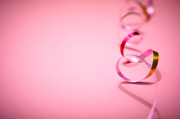 holiday colorful ribbons on pink background - Fotografie, Obrázek