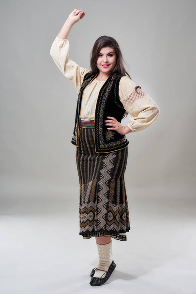 Young Romanian woman in traditional folklore costume - Photo, image