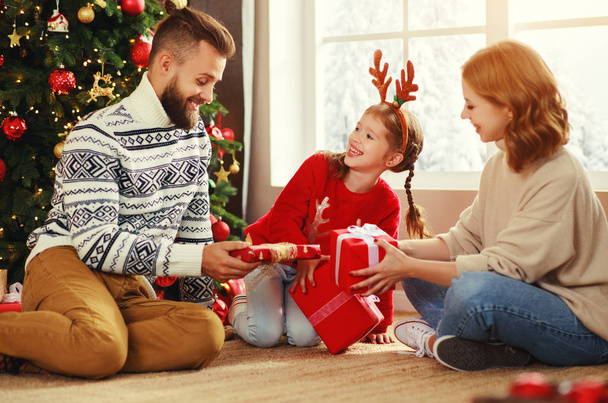 happy family with gifts near   Christmas tree at hom - Photo, Image
