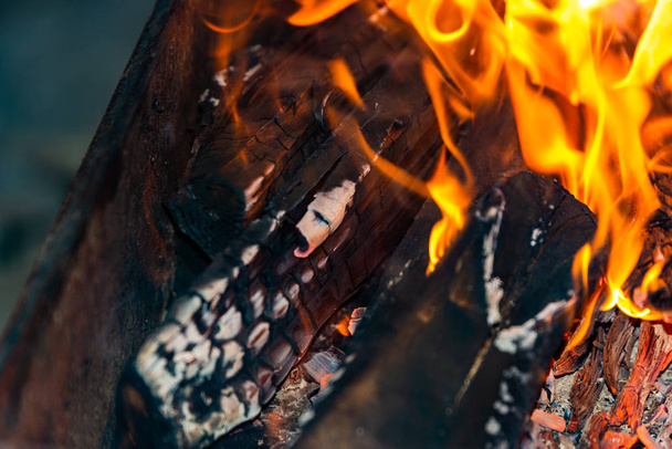 Burning fire in a barbecue grill for frying meat on the street. - 写真・画像