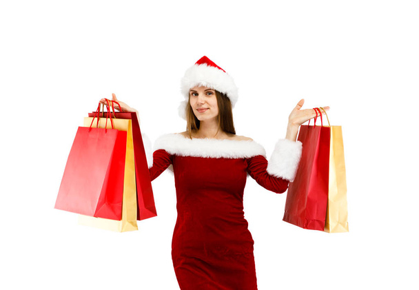 Woman in festive outfit holding gifts for winter holidays - 写真・画像