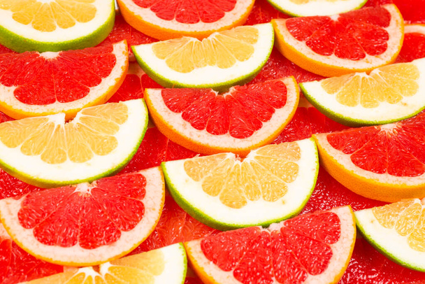 Pomelo és grapefruit szeletek háttér. - Fotó, kép