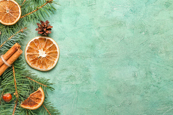Christmas tree branches with spices on color background - Φωτογραφία, εικόνα