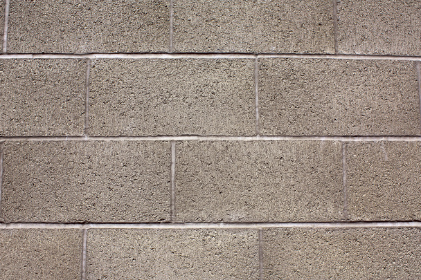 Close-up of gray brick, cinderblock wall. - Foto, imagen