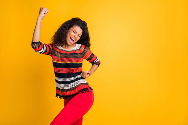 Portrait of her she nice attractive overjoyed cheerful wavy-haired girl in knitted sweater celebrating attainment satisfaction great news isolated on bright vivid shine vibrant yellow color background - Foto, Imagem