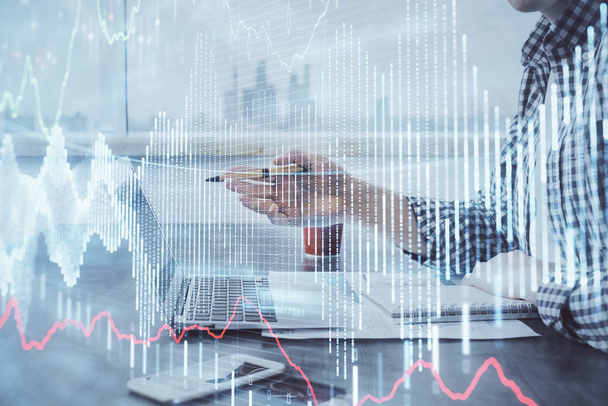 Double exposure of stock market chart with man working on computer on background. Concept of financial analysis. - Foto, afbeelding