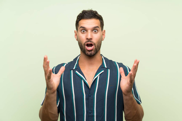 Handsome man over isolated background with surprise facial expression - Fotoğraf, Görsel