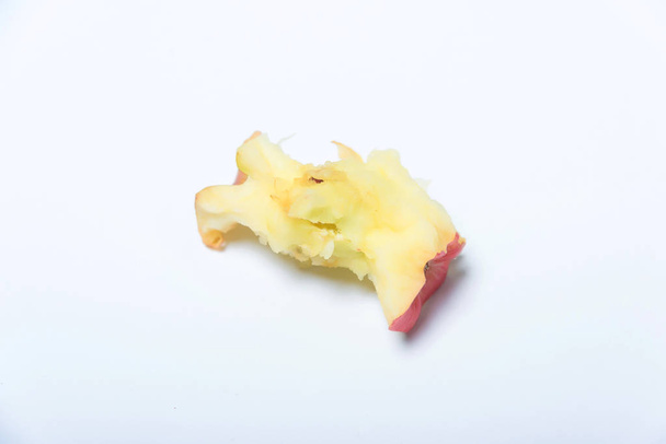 Fresh Apple core. Leftovers from a bitten Apple. An Apple core on a white background. - Photo, Image