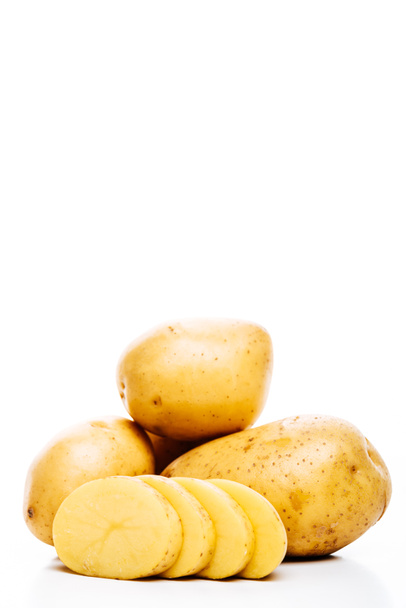 raw whole and sliced fresh potatoes isolated on white - Foto, Imagen