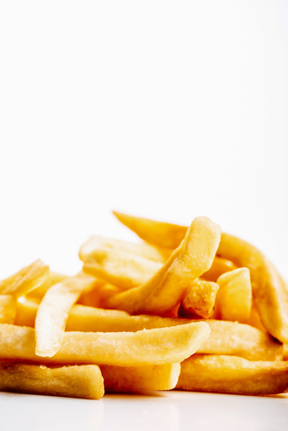 heap of fresh golden french fries isolated on white - Photo, Image