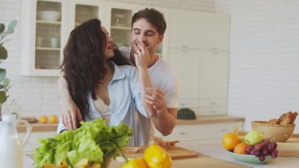 https://cdn.create.vista.com/api/media/small/320417870/stock-video-happy-couple-cooking-together-young-married-couple-flirting-at-home?videoStaticPreview=true&token=