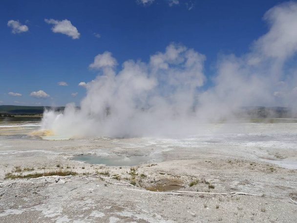 Wide cropped shot of steam rising from the Clepsydra Geyser at t - Photo, Image