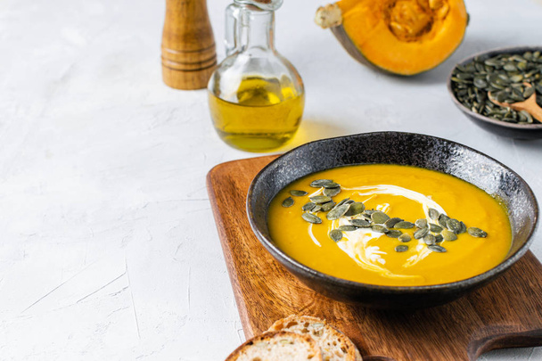 Pumpkin squash soup with seeds, olive oil - Photo, Image
