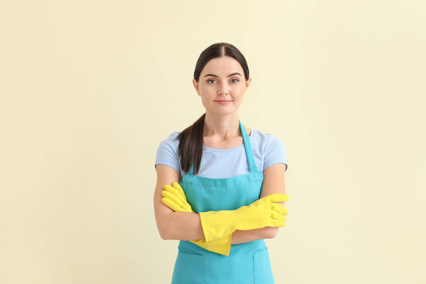 Female janitor on light background - Photo, Image