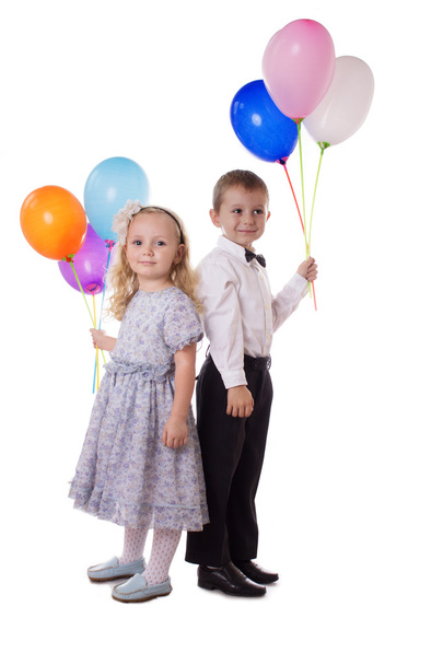 Sweet boy and girl with colorful balloons - Photo, image