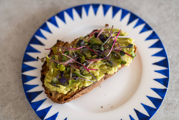 Vegan Food, Avocado Toast with microgreens and edible flowers - Fotografie, Obrázek