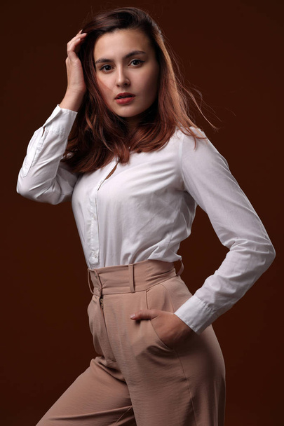 Portrait of a beautiful girl in a white blouse - Zdjęcie, obraz