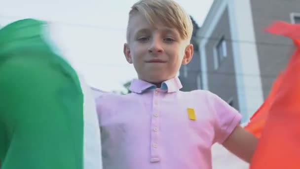 Schoolboy with italian flag looking camera, national fest celebration patriotism - Filmagem, Vídeo